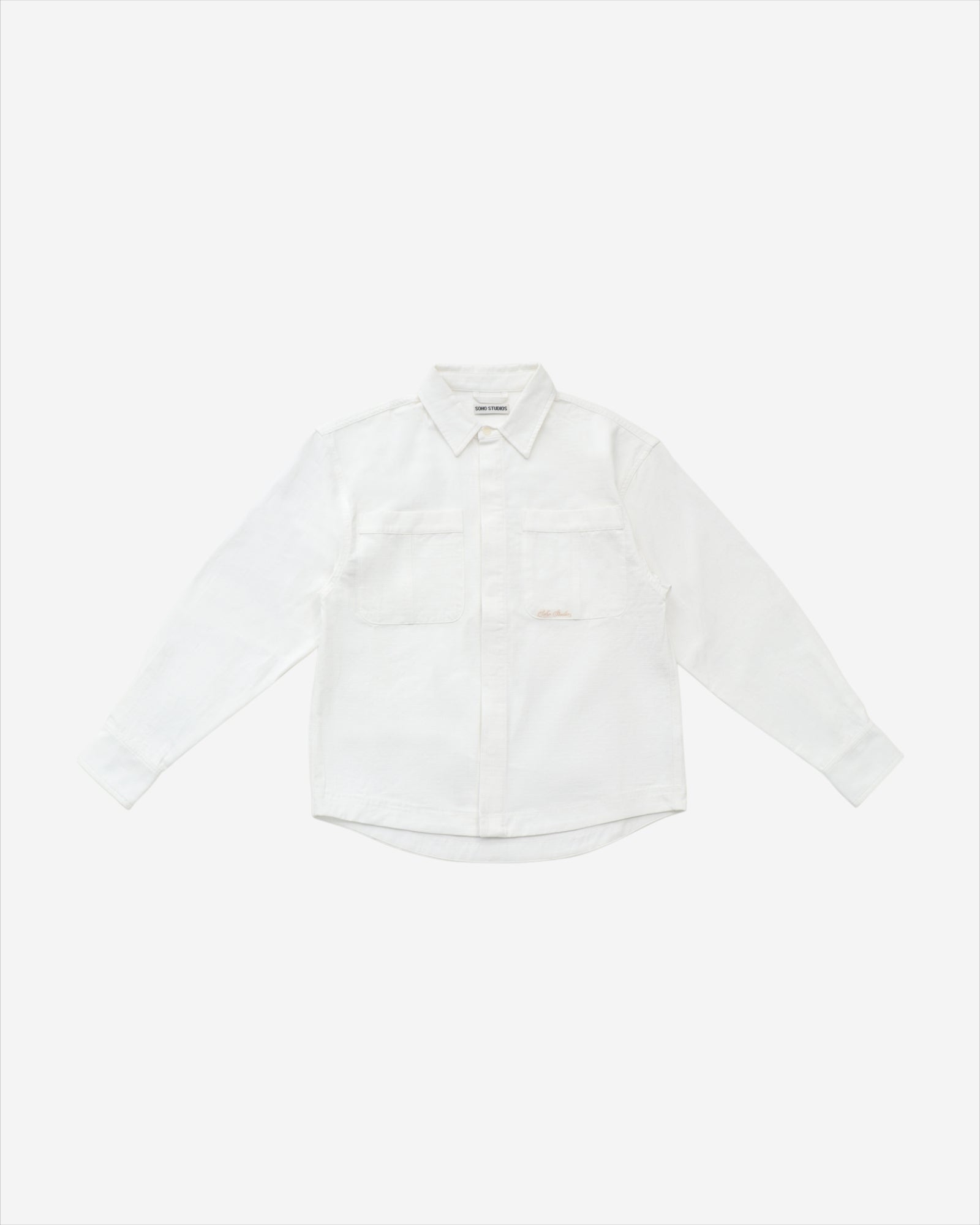 A vintage white long sleeve ripstop oxford shirt with double chest pockets and a hidden button placket, displayed on a plain background.