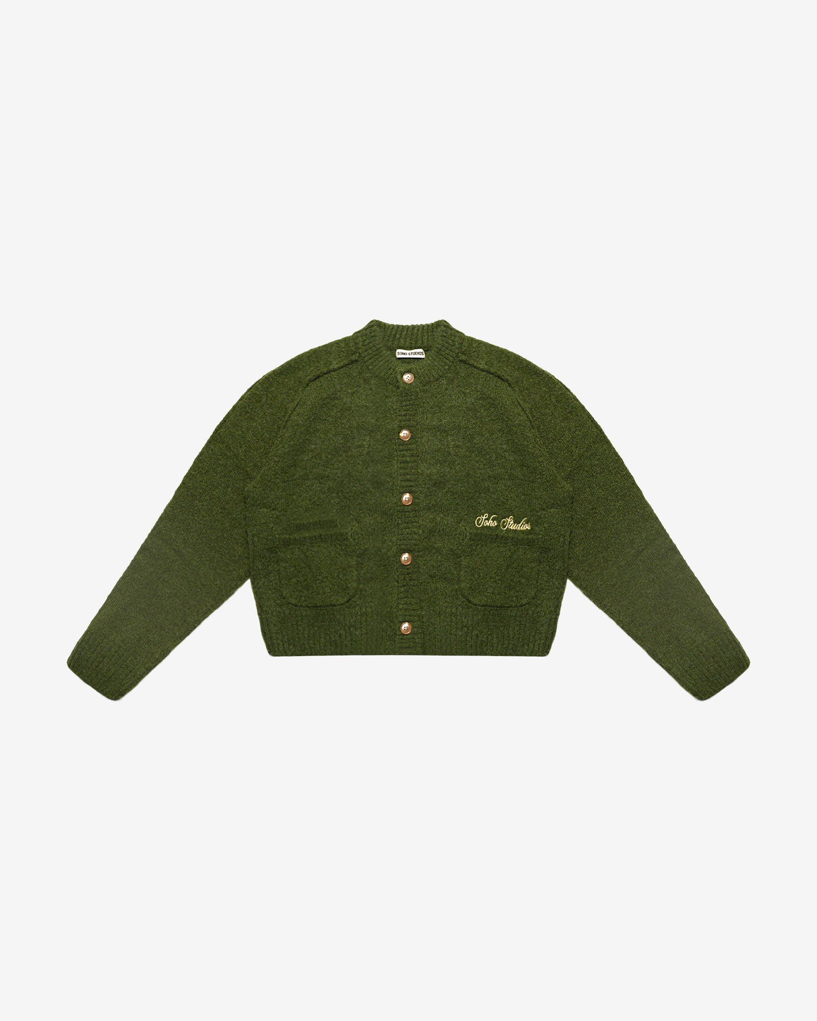 Green knitted cardigan with button details on a white background