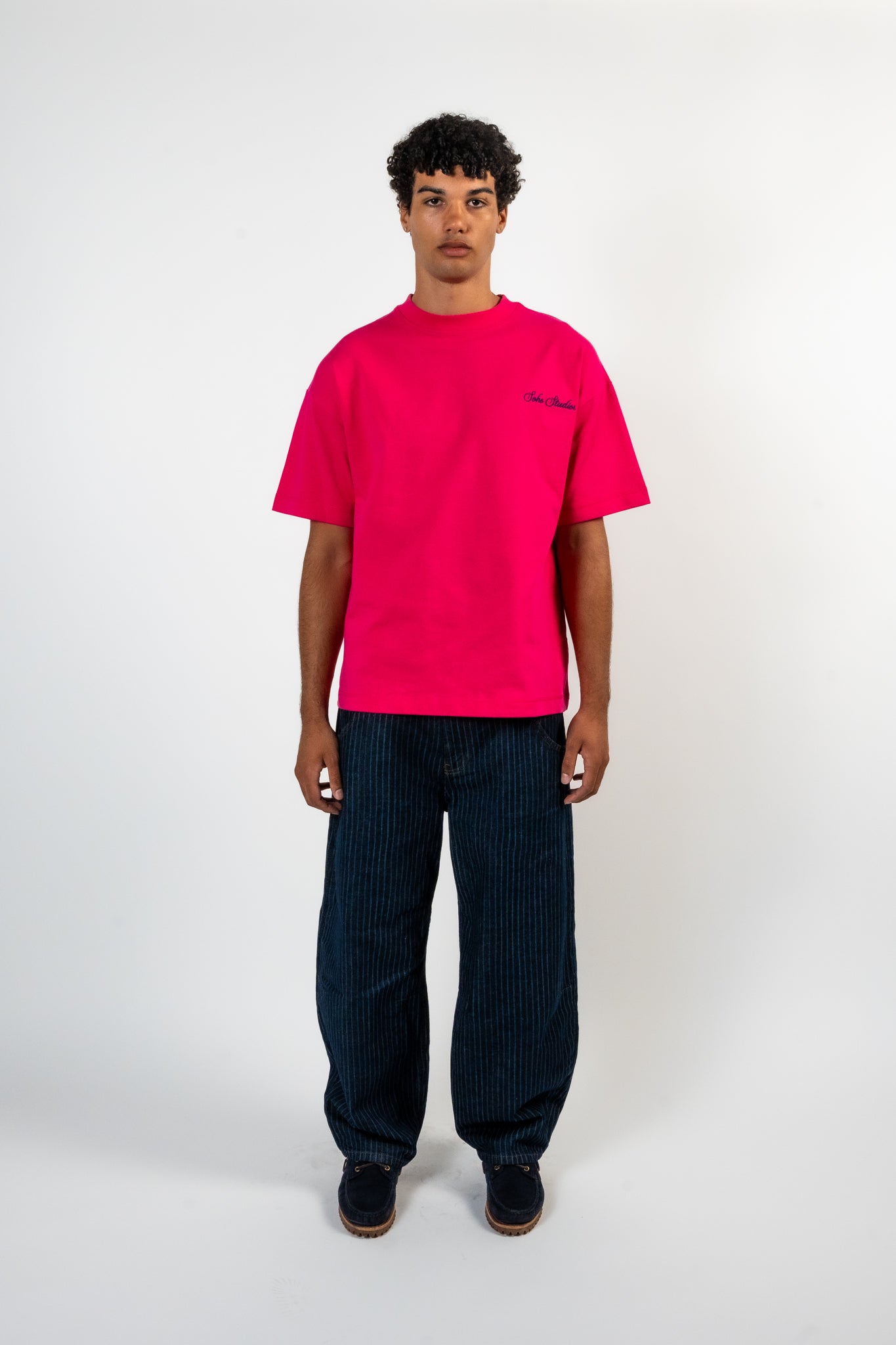 Men Wearing PINK 'SIGNATURE' T-SHIRT with a white background