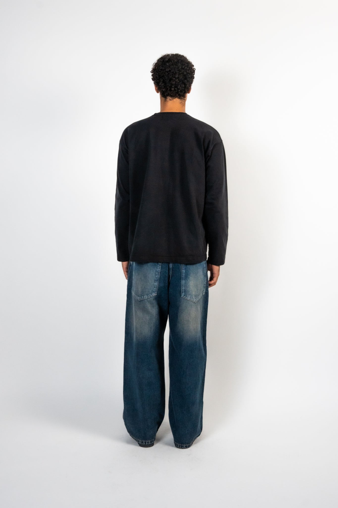 Men Wearing Black Soho Studios long sleeve t-shirt with back pose