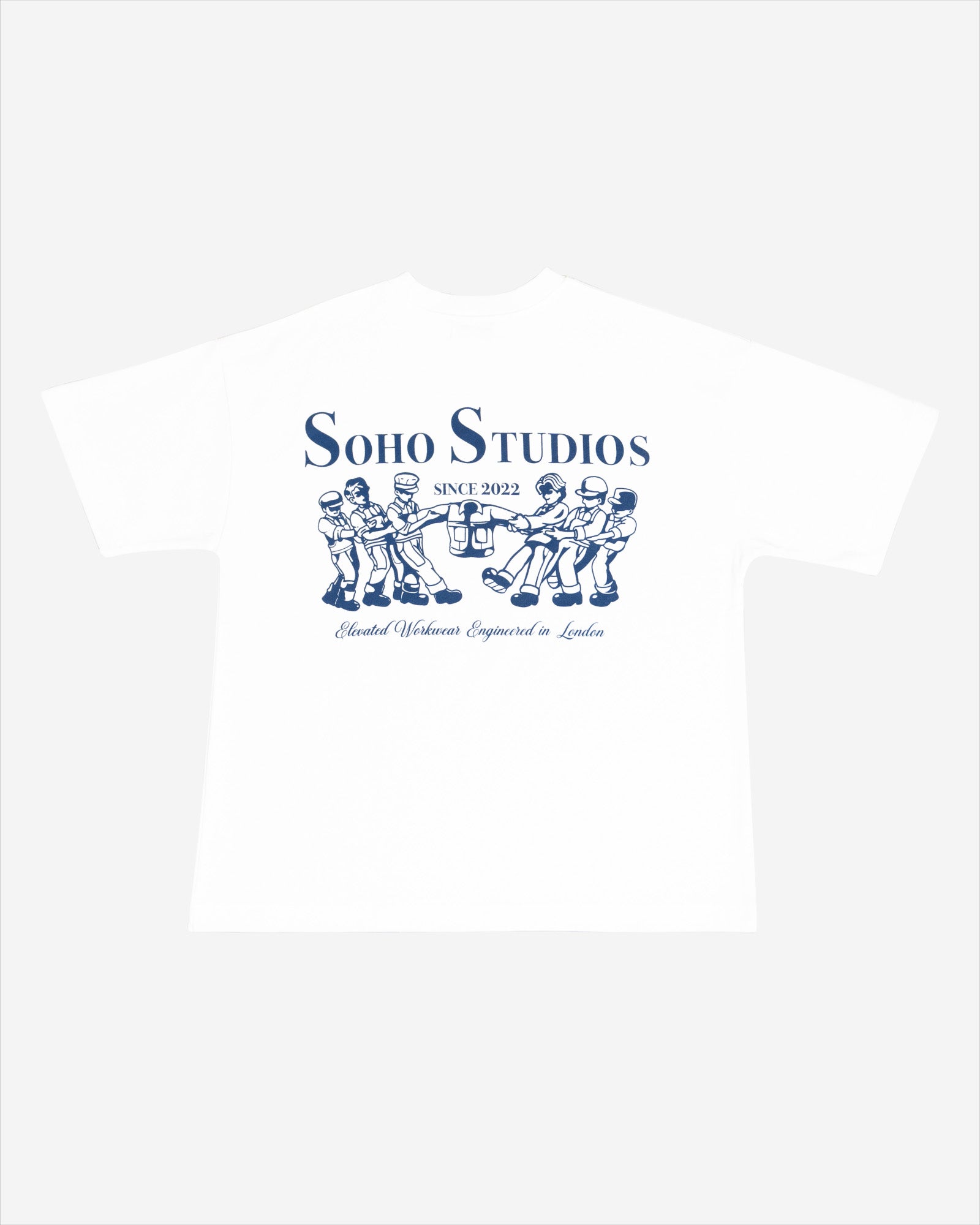 White t-shirt with a navy blue screen printed logo featuring a graphic of three men and the text 'SOHO STUDIOS - ELBOW LANE - LEEDS - ENGLAND'.