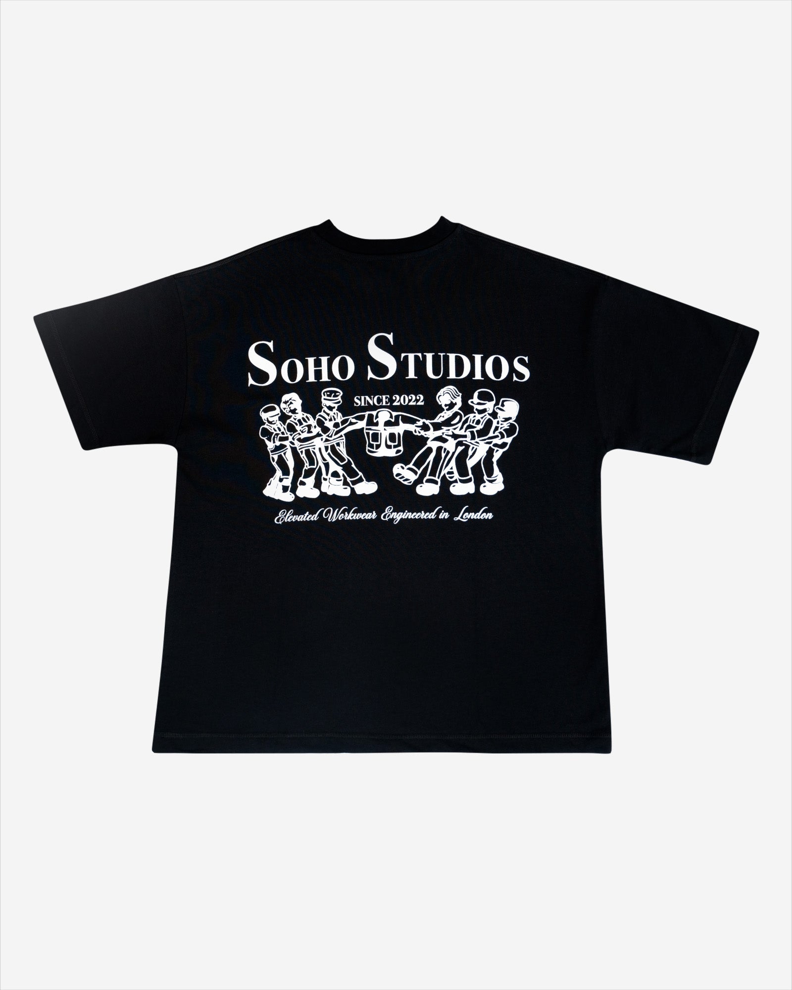 This image features the "Black 'Grafter' T-Shirt," a stylish and vintage-inspired garment perfect for casual wear. The t-shirt is black with a contrasting white graphic on the back that reads "Soho Studios" and includes a detailed illustration of a group of figures with musical instruments, adding a unique visual appeal.