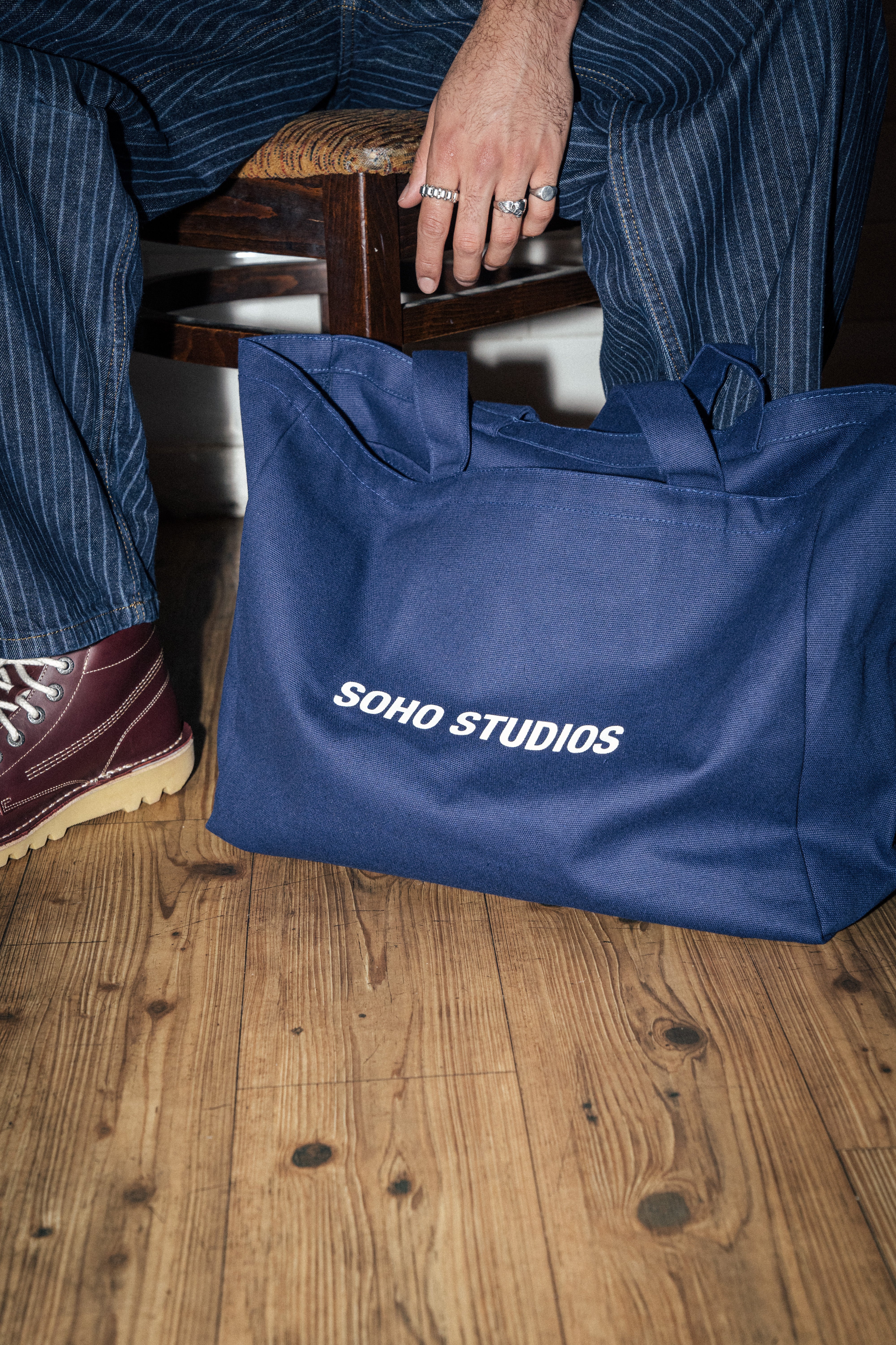 NAVY TOTE BAG on floor 

